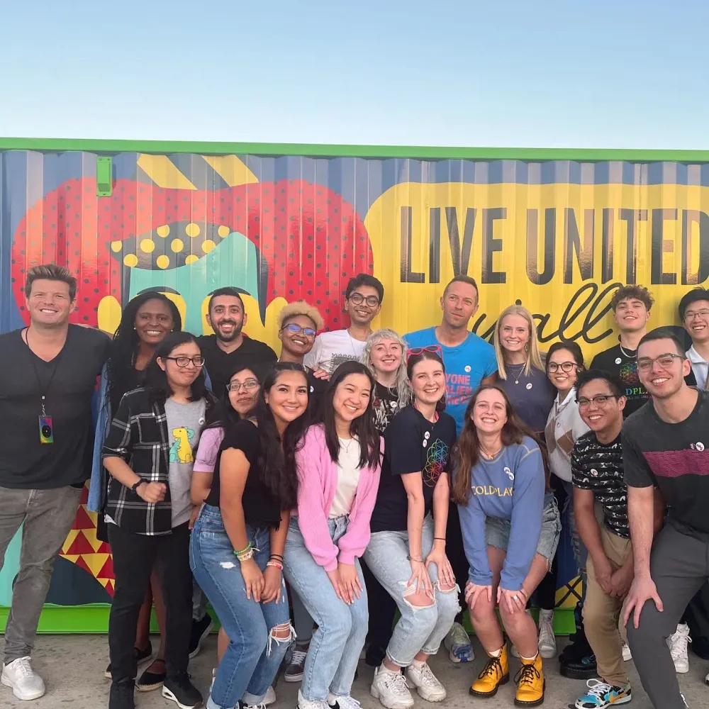 Jimmy Dushku with Chris Martin and a group of friends at the Cotton Bowl in Dallas