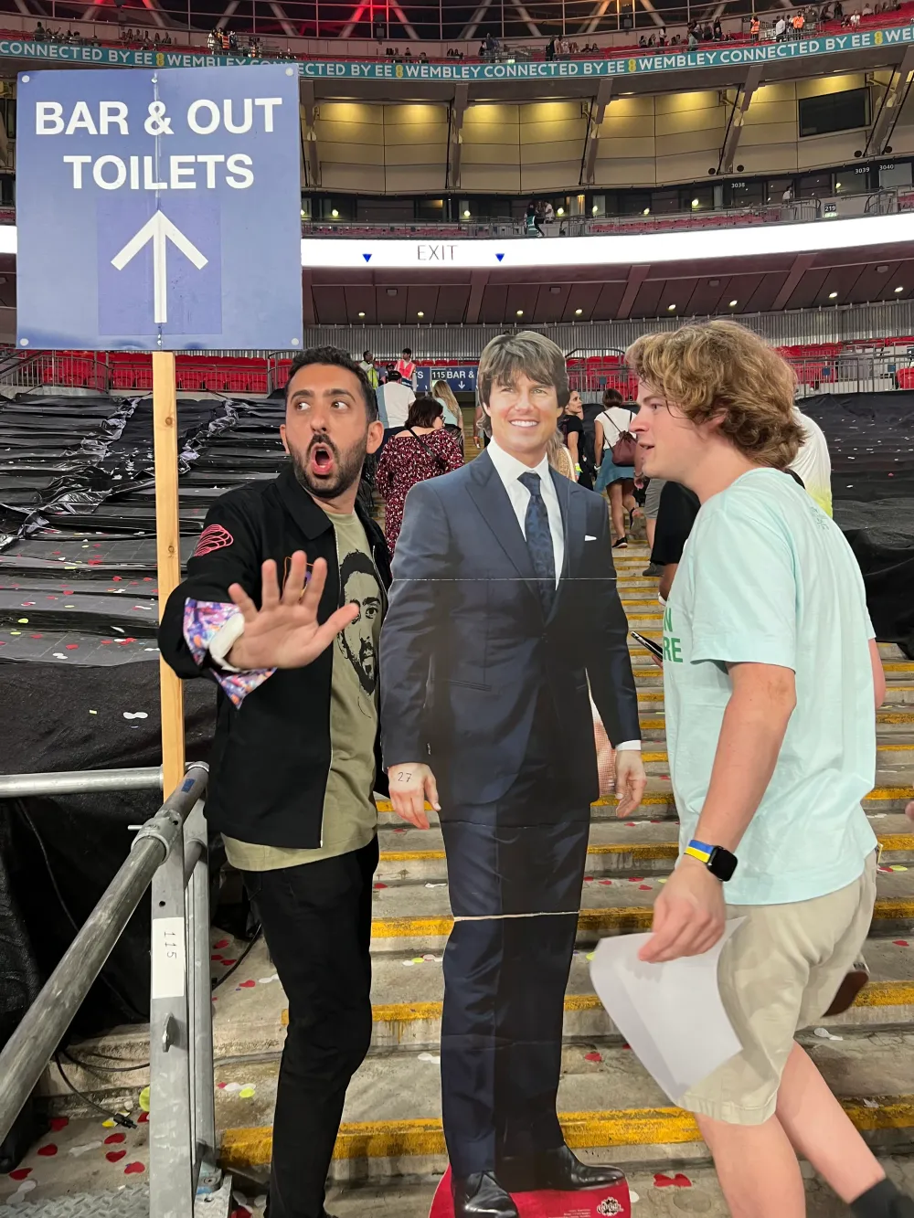 Jimmy Dushku escorting cardboard Tom Cruise away from fans