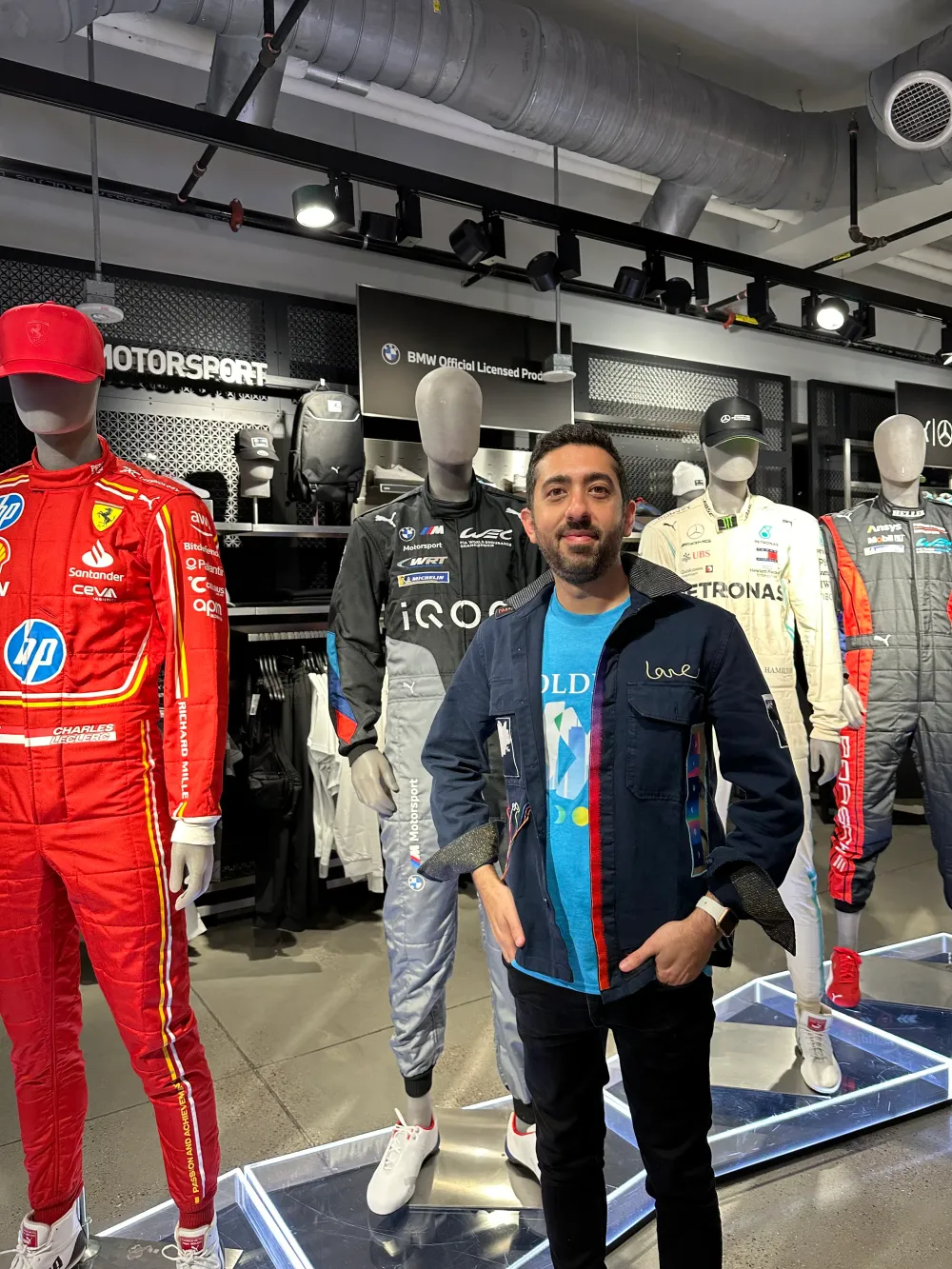 At the Puma store, checking out F1 racing suits on display