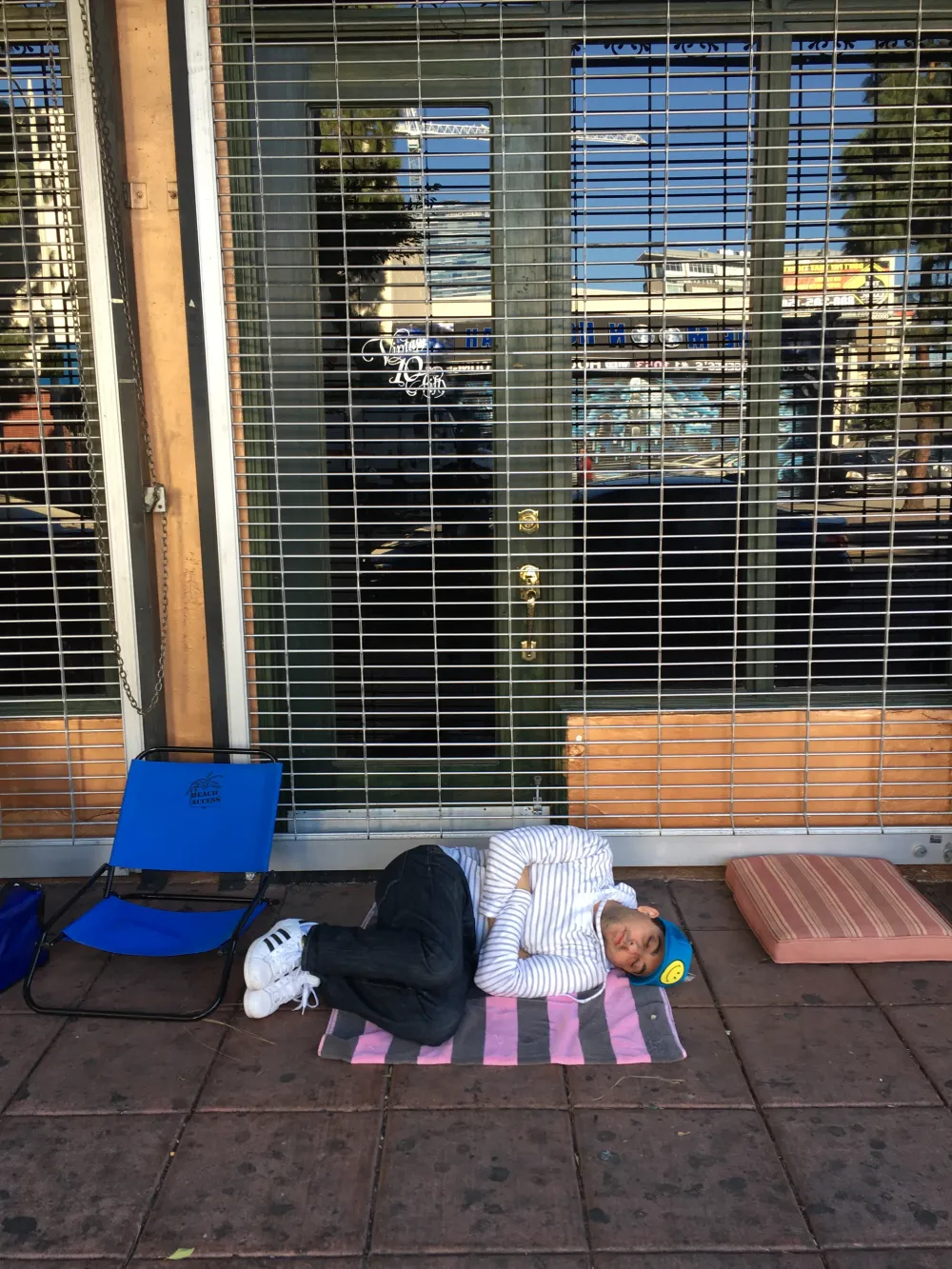 Jimmy Dushku sleeping on the sidewalk in line outside the Belasco Theatre