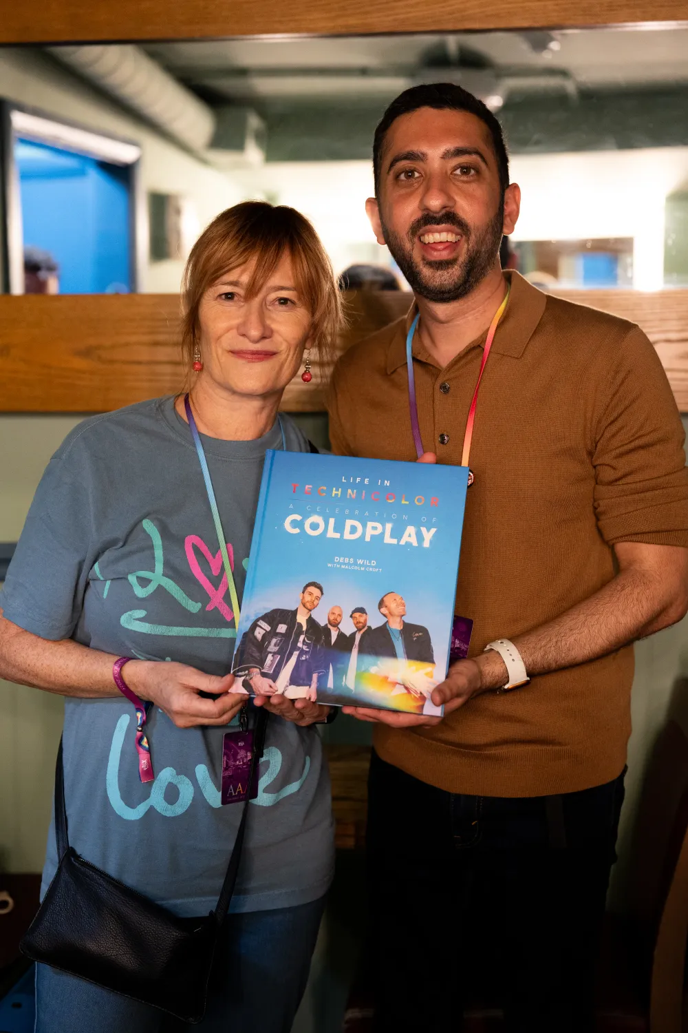Jimmy Dushku with Debs Wild holding her updated book, Life in Technicolor, A Celebration of Coldplay