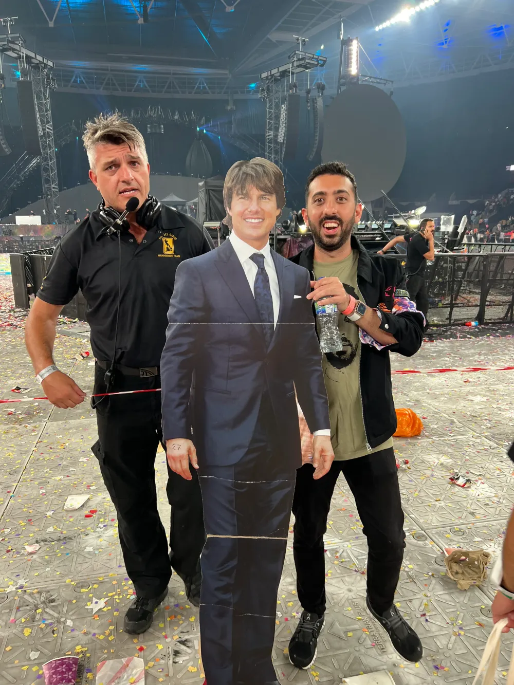 Jimmy Dushku and security escorting the cardboard Tom Cruise cutout out of Wembley