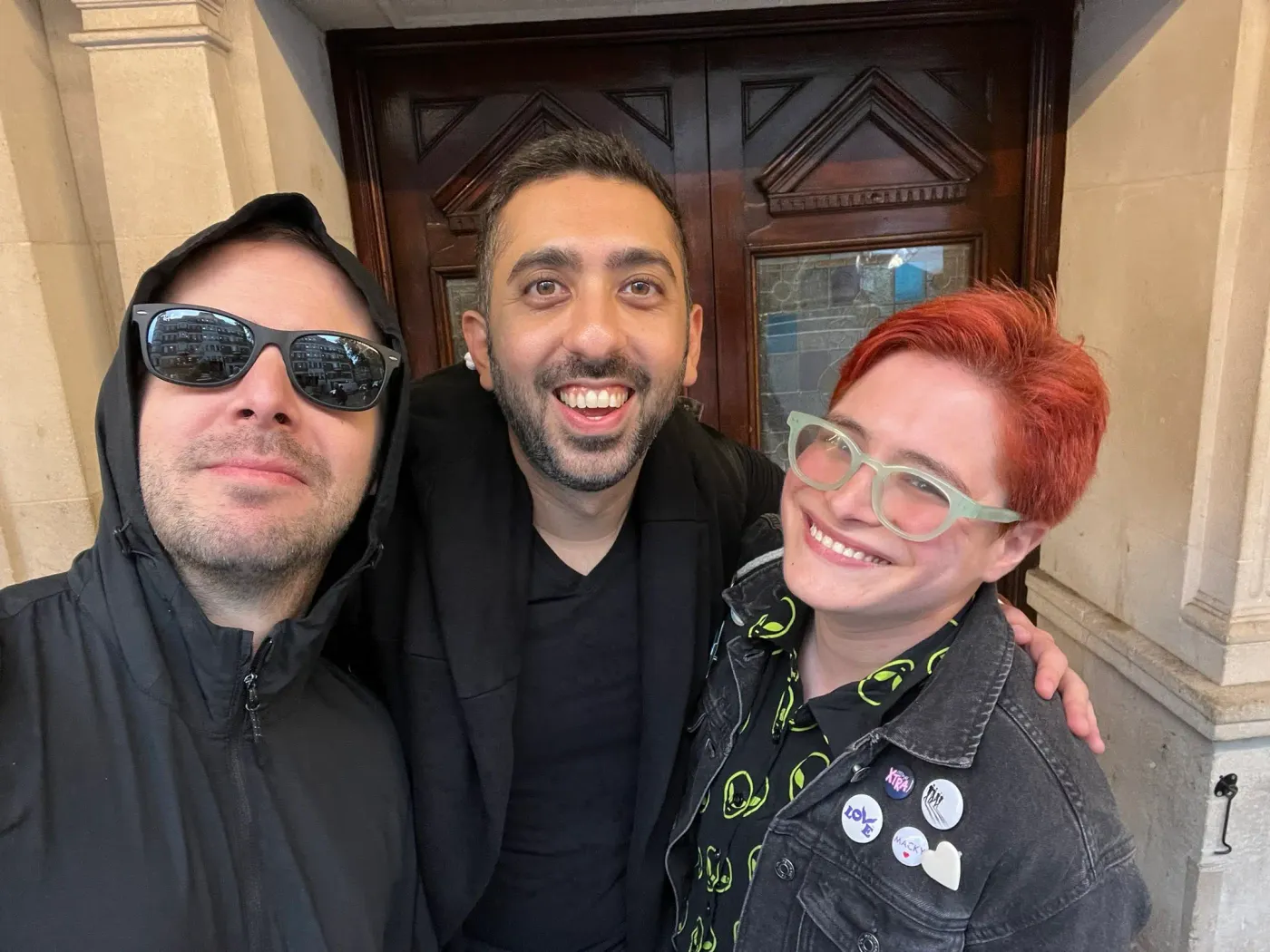 Jimmy Dushku with Oz and Hayley sheltering from the rain under a building overhang
