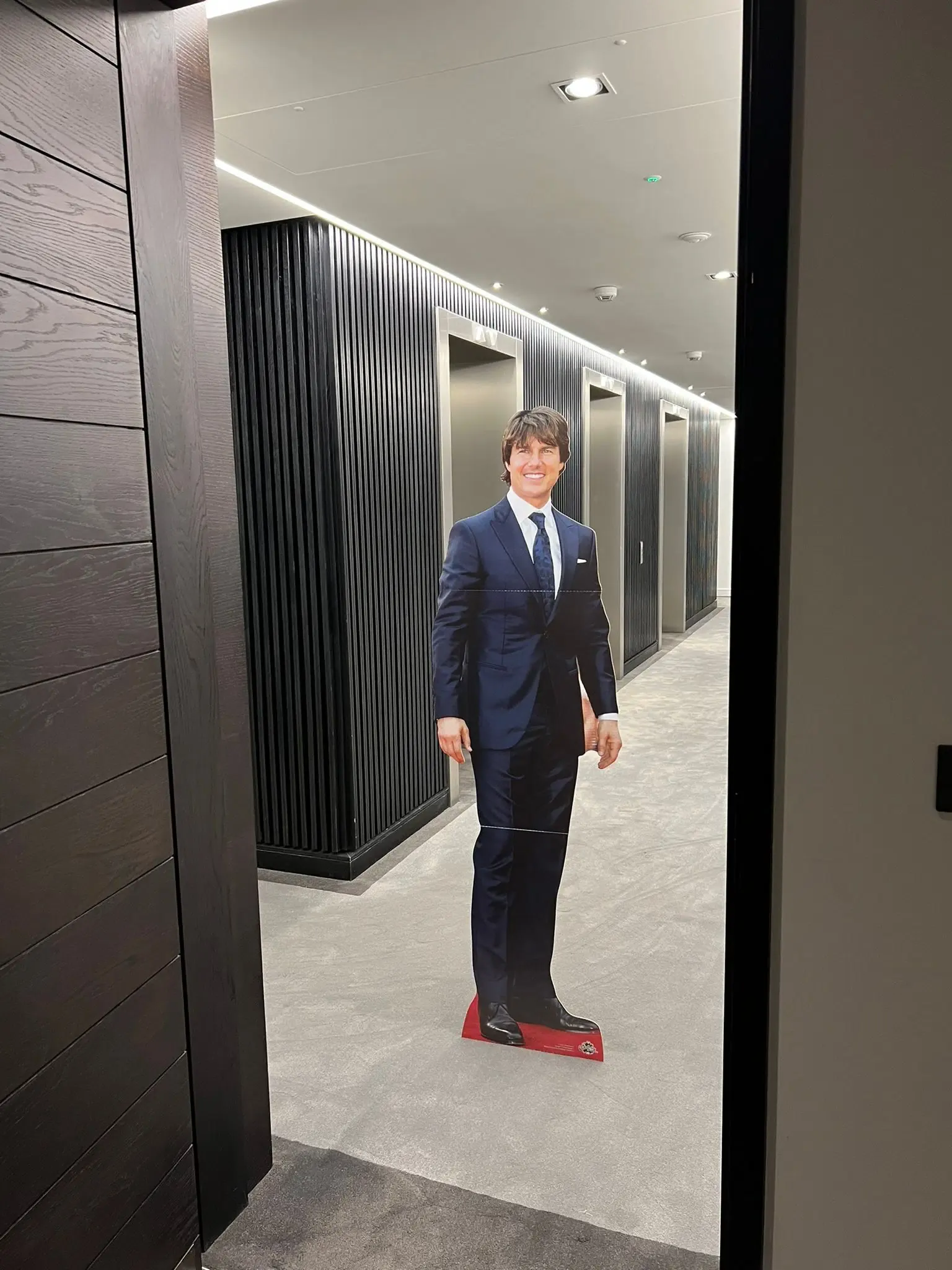 Tom surprising people in corridors