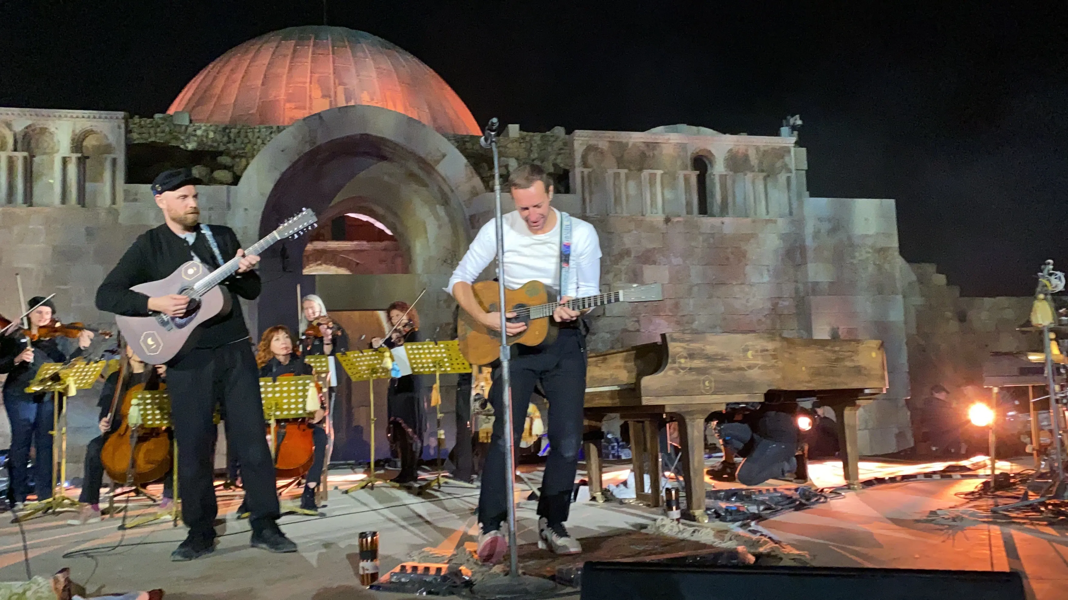 Coldplay performing with a live string section