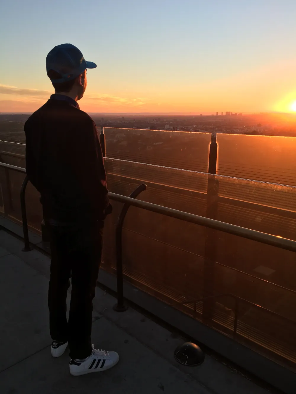 Jimmy Dushku looking out over Los Angeles from Griffith Observatory at sunset