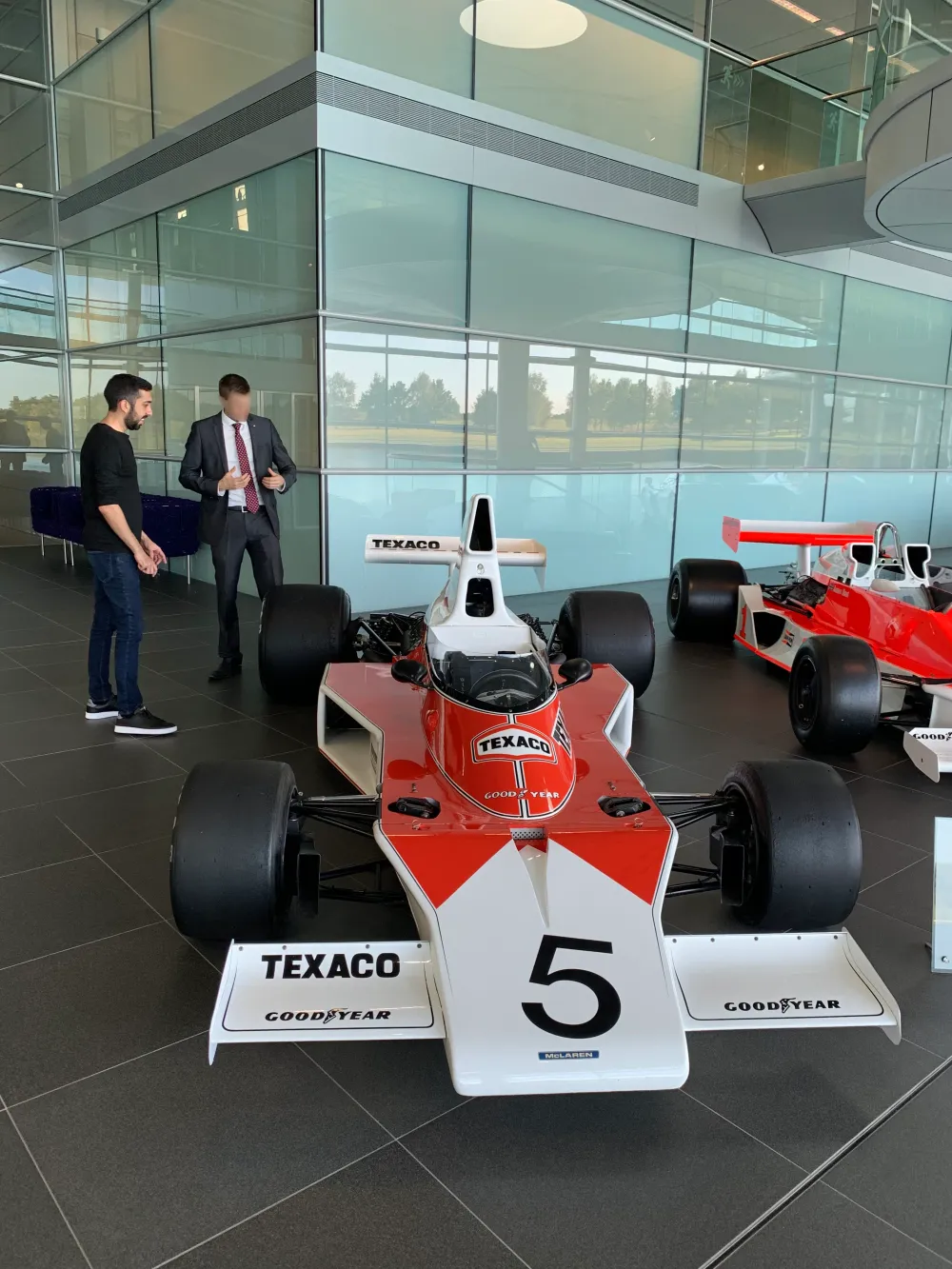 Jimmy Dushku talking with a McLaren staff member during a tour of the Technology Centre